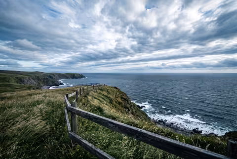Coastal bluff overlook, wide — Landing page imagery, aspirational hero.